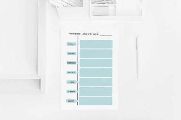 Printable weekly planner on a desk