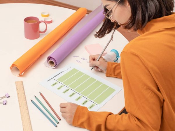 Woman planning her week with weekly planner