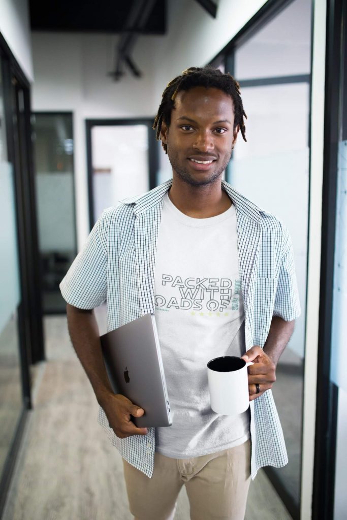 Smiling man holding coffee mug